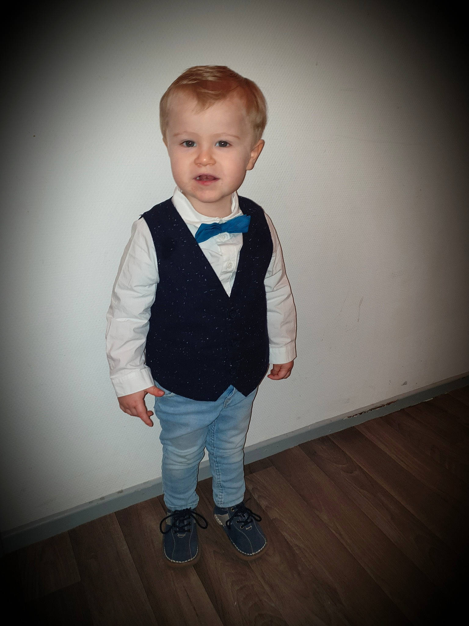 Ethan participe au concours pour gagner de l'argent avec cette photo : blue, cheek, child, child_model, formal_wear, male, outerwear, person, photography, smile, standing, suit, suspenders, t_shirt, toddler, vest