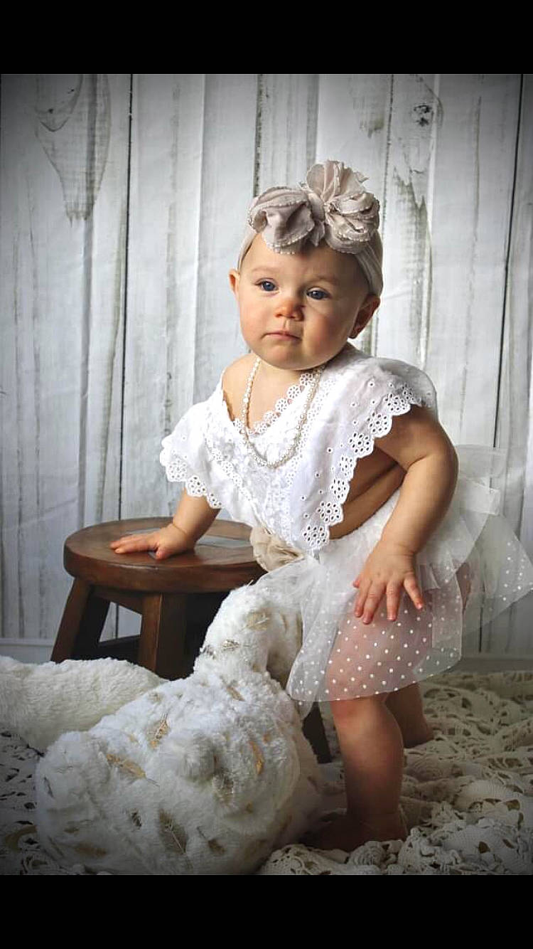Abelle joined the competition — help win amazing prizes! baby_toddler_clothing, bridal_accessory, bridal_clothing, child, day_dress, dress, embellishment, event, fashion, fashion_design, flash_photography, gown, happy, headpiece, human_body, leg, person, shoe, sitting, sleeve