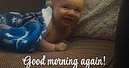 Koah is registered to the contest to win money with this photo: baby, blanket, couch, pillow, smile, face, infant, child, happy, indoor, text_overlay, fabric, cozy, person, portrait, morning, greeting, home, resting, cute