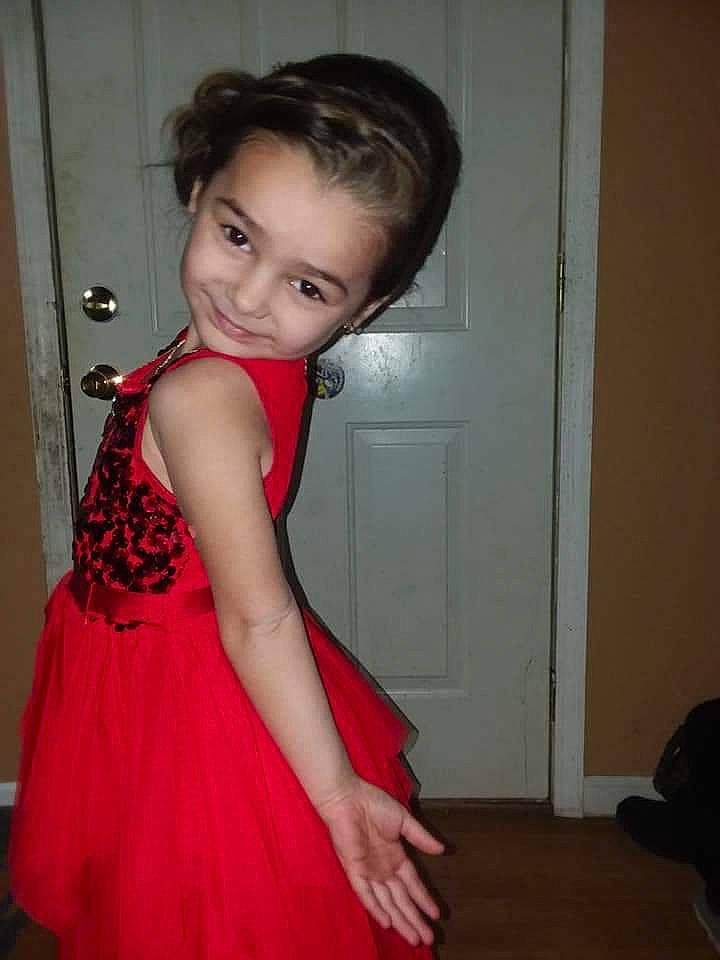 Arora is registered to the contest to win money with this photo: abdomen, brown_hair, child, child_model, cocktail_dress, dress, girl, gown, hair, hairstyle, human_hair_color, joint, lady, leg, long_hair, person, shoulder, skin, smile, standing