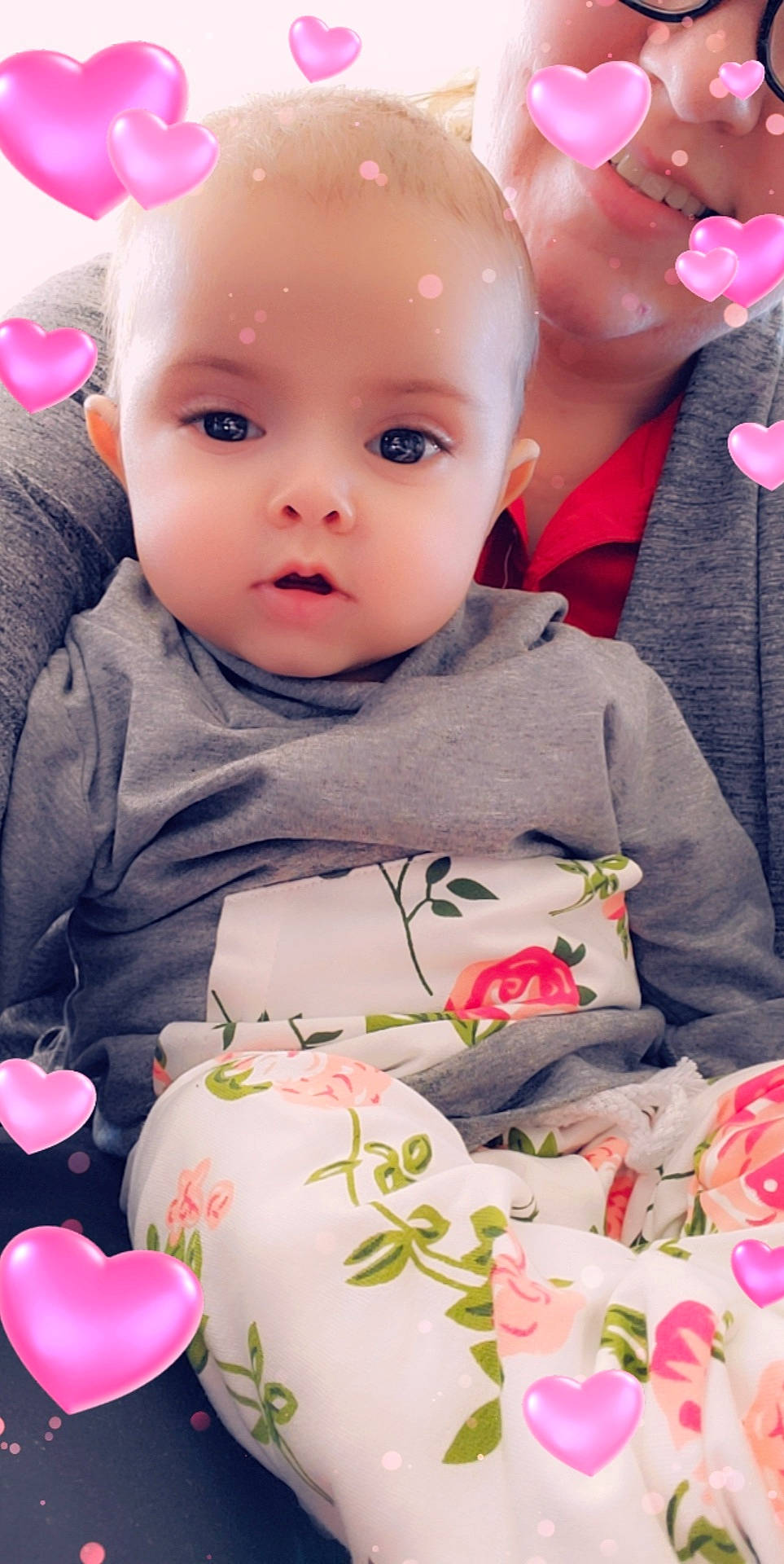 Isabelle is registered to the contest to win money with this photo: baby, baby_toddler_clothing, cheek, child, ear, eyelash, flowering_plant, iris, lip, love, mouth, nose, peach, person, petal, pink, rose_family, rose_order, skin, sweetness