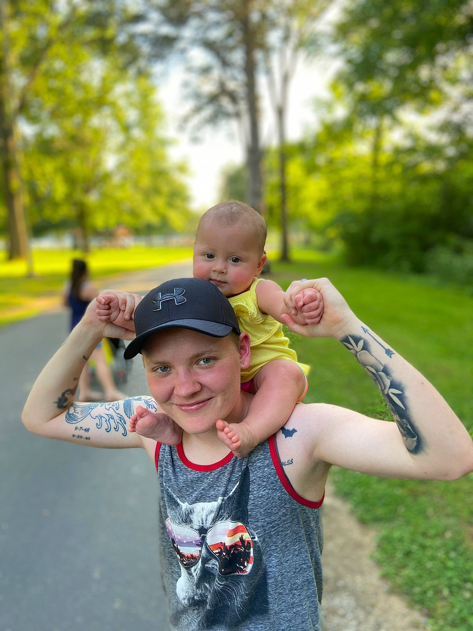 Hensley is registered to the contest to win money with this photo: arm, child, facial_expression, fun, grass, green, hand, happy, headwear, joint, joy, people, person, photograph, photography, shoulder, skin, smile, summer, toddler