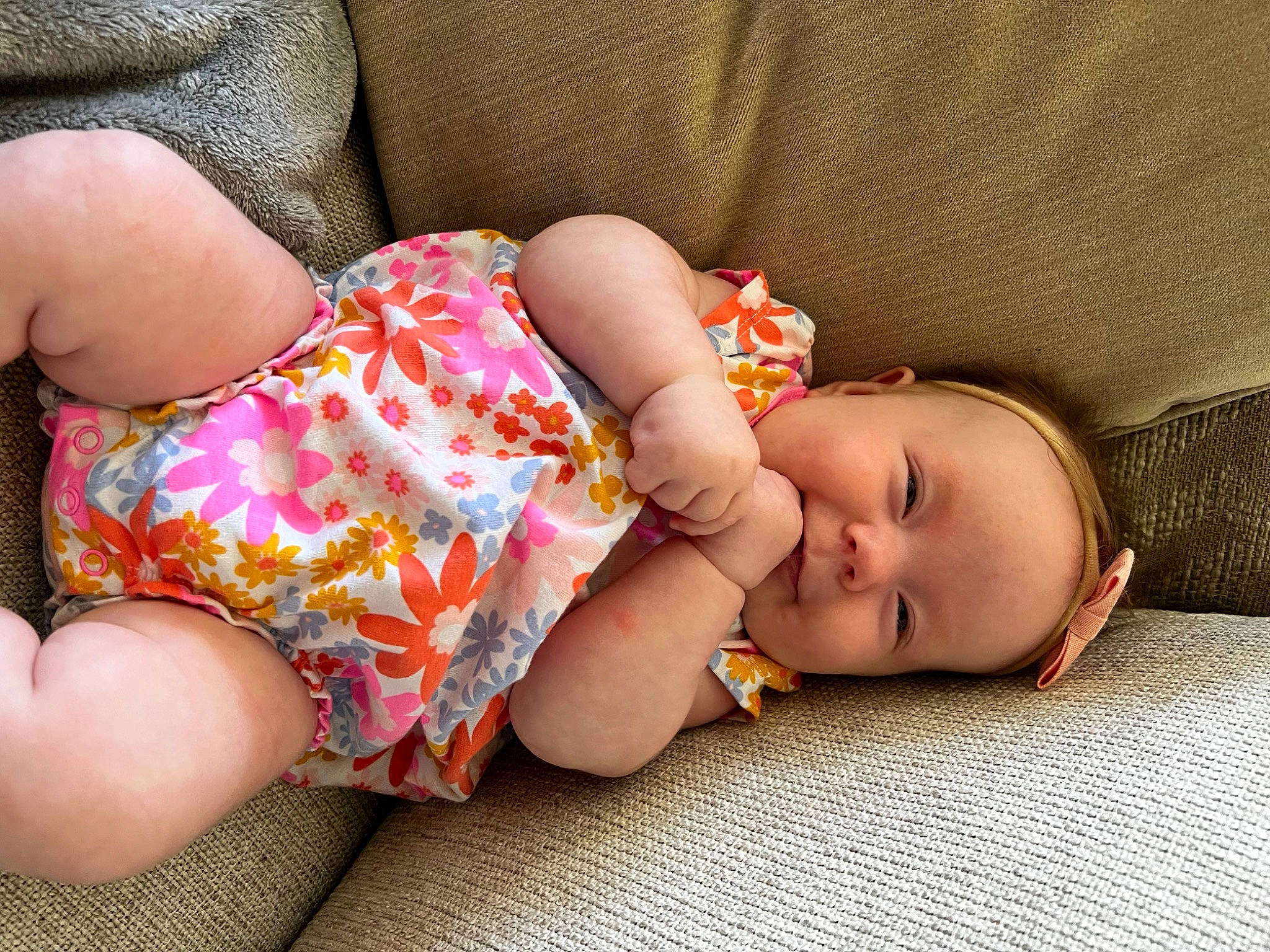 June is registered to the contest to win money with this photo: baby, baby_sleeping, baby_toddler_clothing, beauty, child, comfort, finger, flooring, foot, grass, hand, headgear, human_leg, joy, nap, pattern, person, sitting, skin, thigh