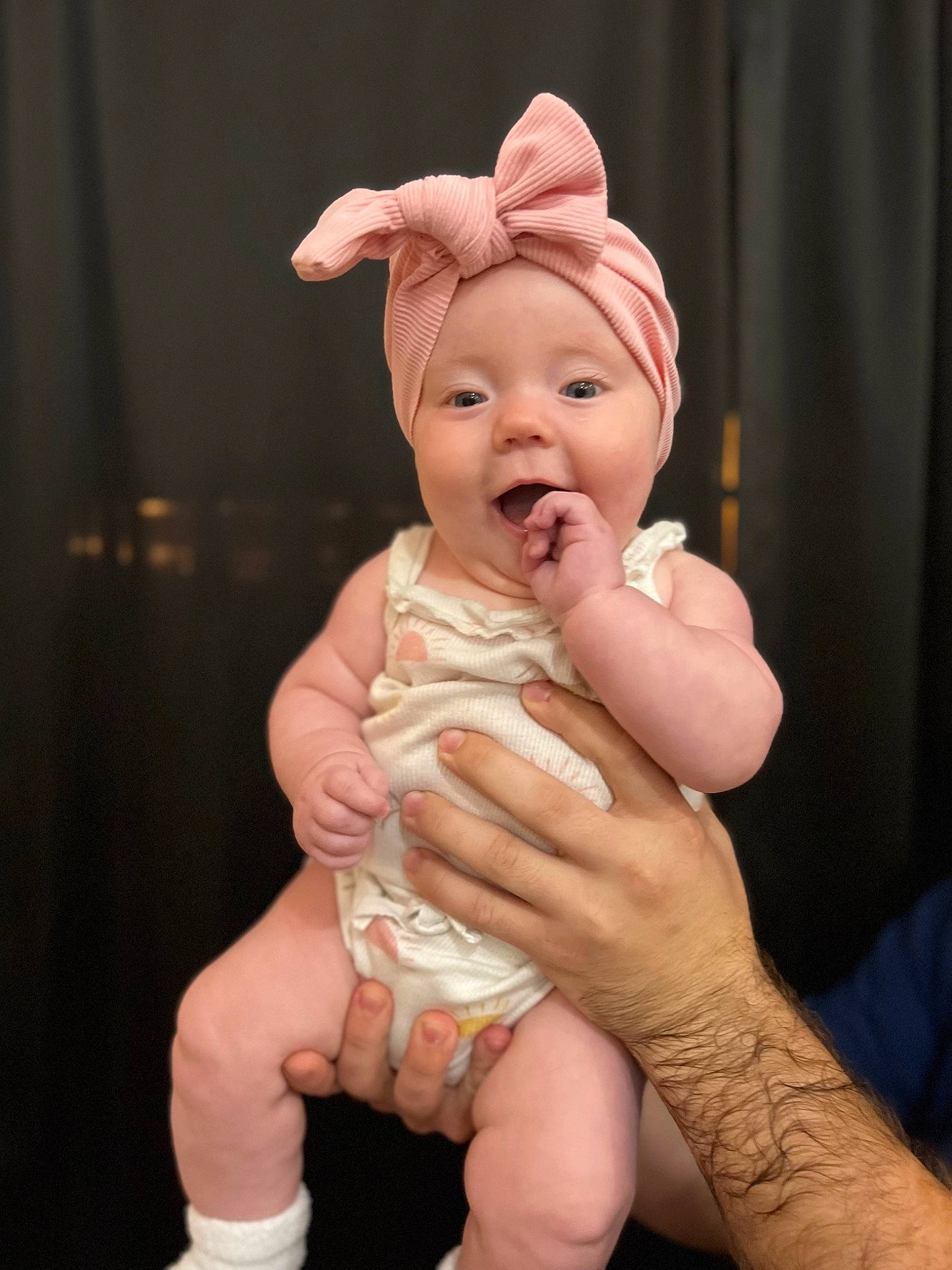 June joined the competition — help win amazing prizes! abdomen, art, baby, cheek, curtain, ear, finger, foot, gesture, happy, hat, head, headwear, human_leg, nail, person, sitting, smile, thumb, toddler