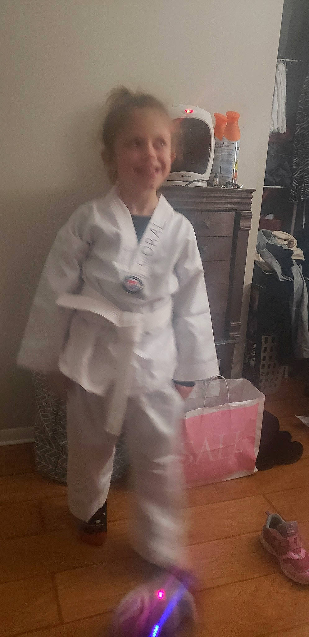 Coral is registered to the contest to win money with this photo: costume, dobok, japanese_martial_arts, joy, judo, karate, martial_arts, martial_arts_uniform, person, robe, taekwondo, uniform