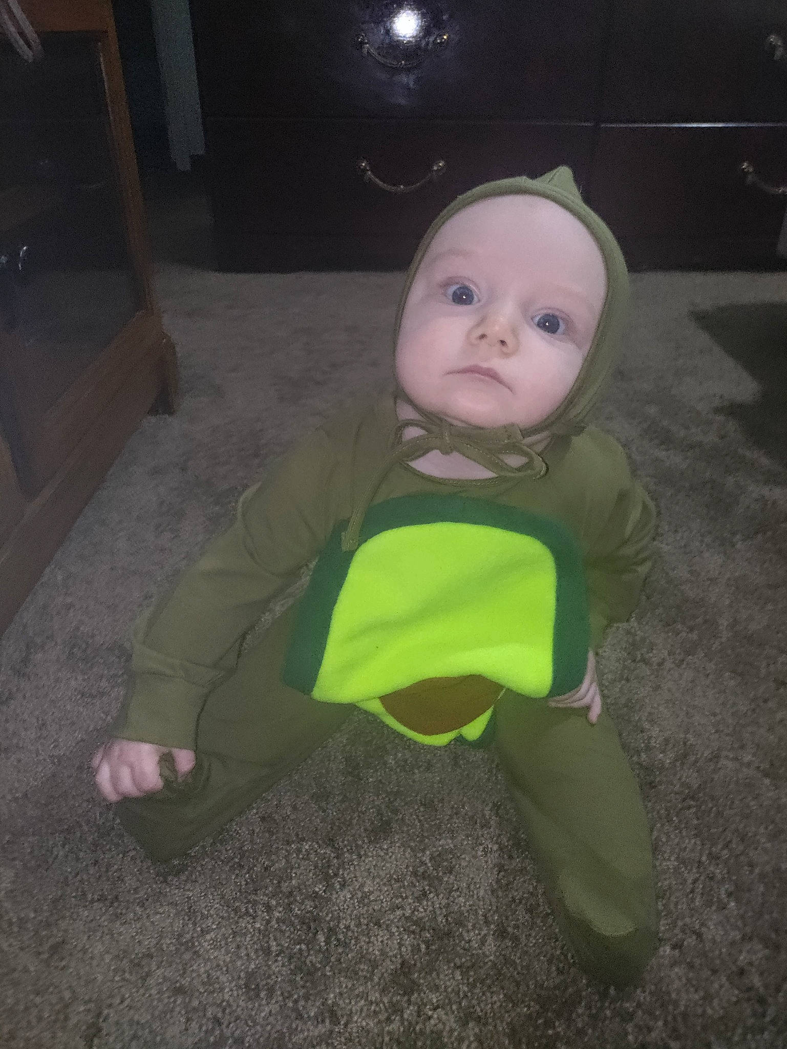 Phoenix joined the competition — help win amazing prizes! baby, baby_toddler_clothing, carmine, cheek, child, darkness, eye, flooring, fun, grass, human_body, nose, person, personal_protective_equipment, plastic, sitting, sleeve, t_shirt, toddler, wood