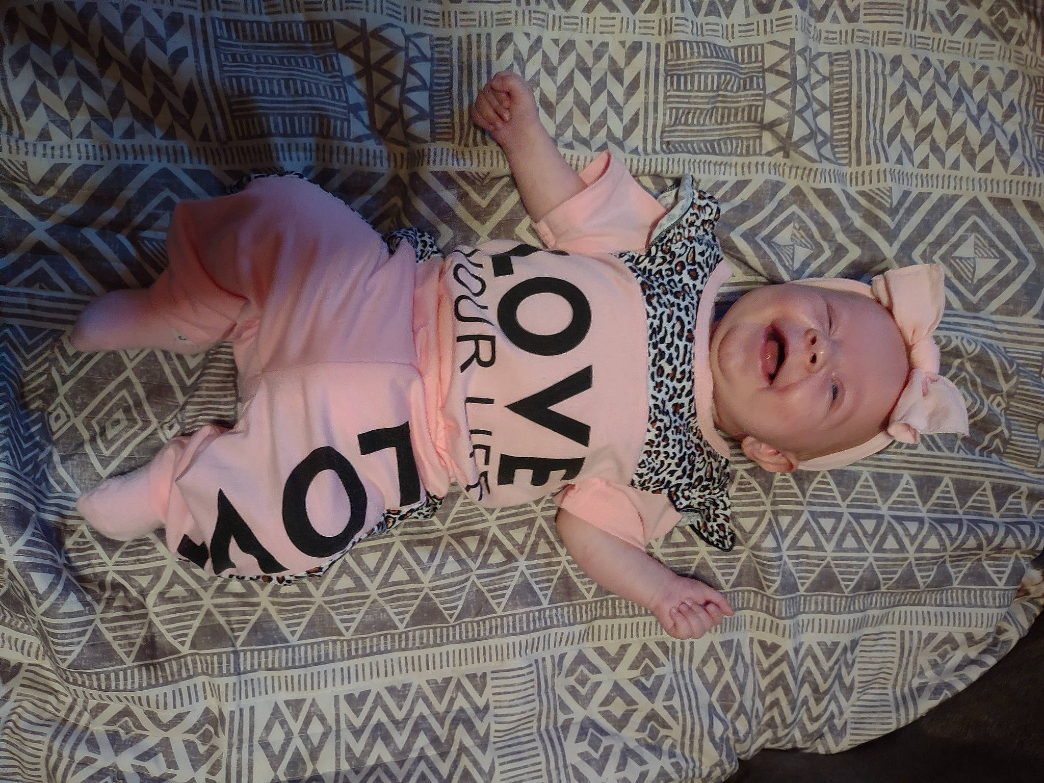 Annabella is registered to the contest to win money with this photo: baby, baby_toddler_clothing, child, comfort, eyelash, flesh, flooring, font, linens, mammal, pattern, person, pink, room, sleeve, smile, thigh, toddler, wood, wrist