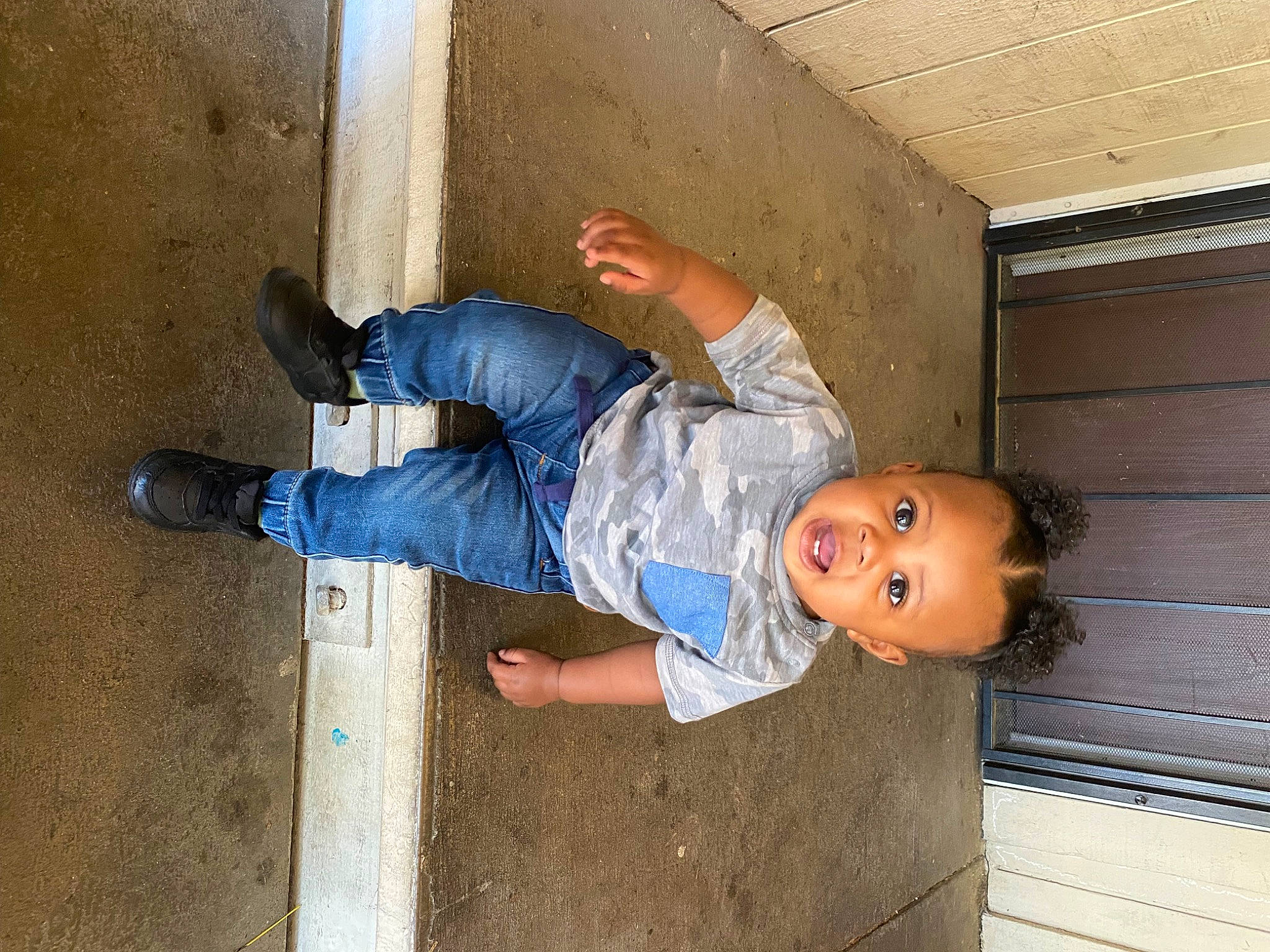 Dakota is registered to the contest to win money with this photo: baby_toddler_clothing, child, concrete, denim, elbow, electric_blue, flooring, fun, hat, human_leg, knee, leg, leisure, outdoor_shoe, person, thigh, toddler, walking_shoe, wood, world