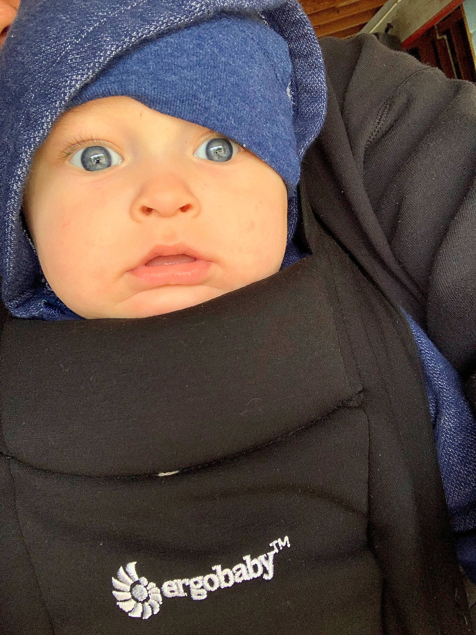 Levii is registered to the contest to win money with this photo: baby, beanie, bonnet, cheek, child, comfort, eyebrow, headgear, headwear, hood, hoodie, person, polar_fleece, sleeve, sweatshirt, winter, zipper