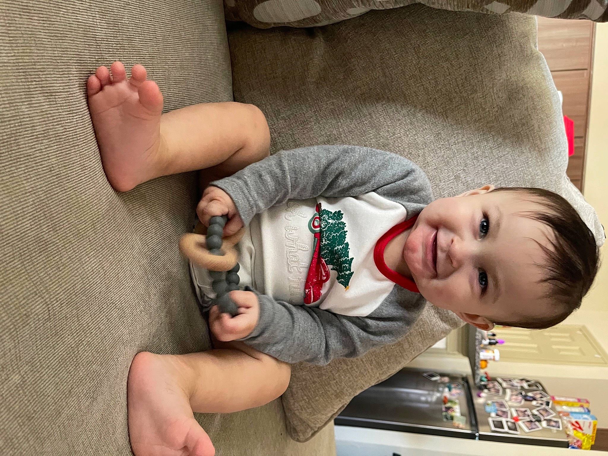 Levii is registered to the contest to win money with this photo: ankle, baby, baby_products, baby_toddler_clothing, barefoot, child, comfort, couch, finger, foot, human, joy, laugh, living_room, nail, person, sole, thumb, toddler, toe