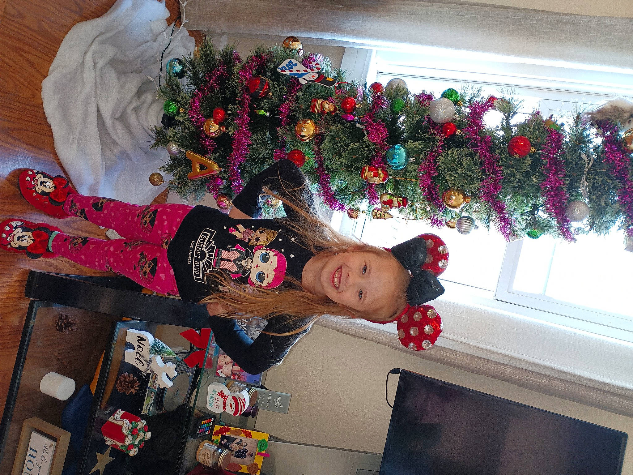 Annalia is registered to the contest to win money with this photo: carmine, christmas, christmas_decoration, christmas_ornament, christmas_tree, conifer, event, fun, happy, holiday, holiday_ornament, interior_design, joy, ornament, person, plant, red, room, textile, tradition