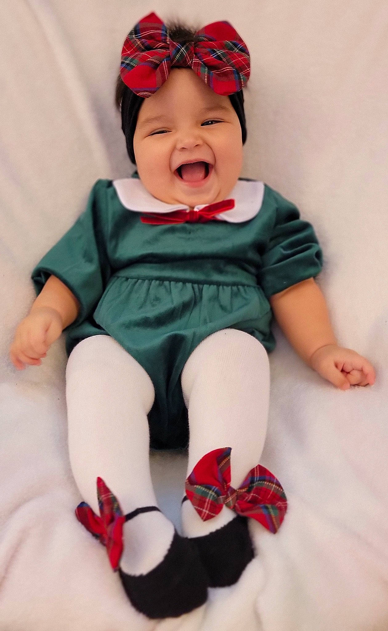 Nora is registered to the contest to win money with this photo: baby, baby_products, baby_toddler_clothing, cap, cheek, comfort, face, fashion_accessory, happy, headwear, human_leg, knee, pattern, person, pink, red, sleeve, smile, sock, t_shirt