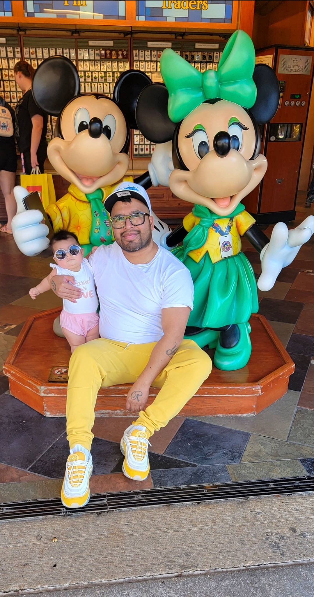 Nora is registered to the contest to win money with this photo: blue, event, fictional_character, fun, green, happy, hat, headwear, leisure, mammal, mascot, people, person, photograph, smile, snapshot, stuffed_toy, textile, toy, vertebrate