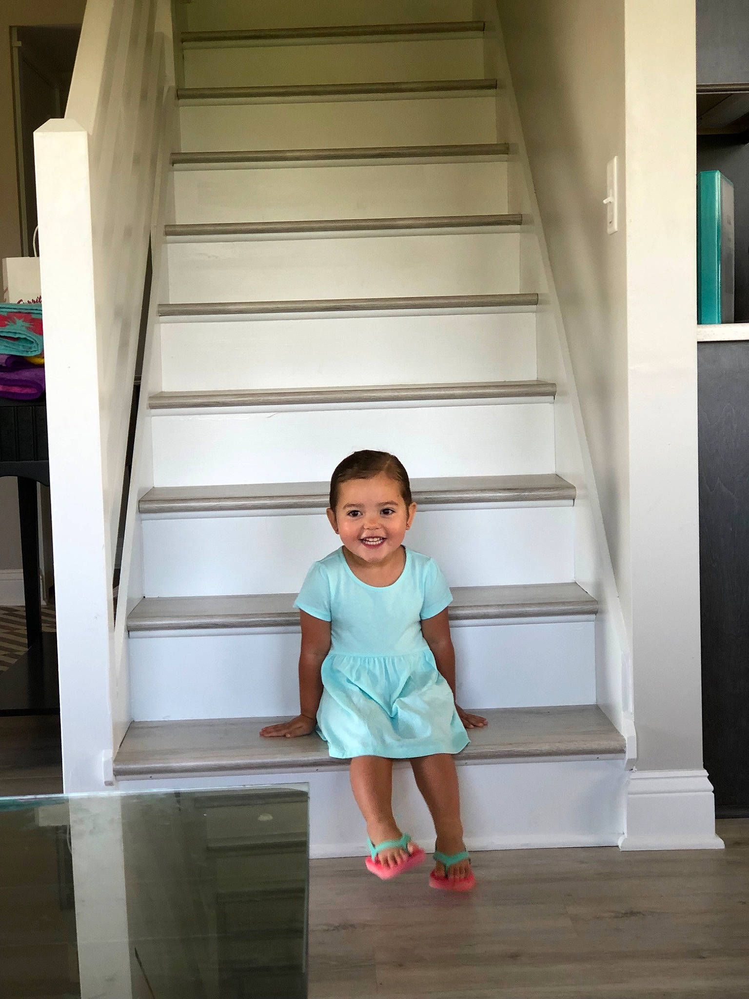 Maggie joined the competition — help win amazing prizes! architecture, child, floor, footwear, furniture, hardwood, home, house, joy, person, photography, room, shelf, shoe, stairs, standing, toddler, vacation, wood