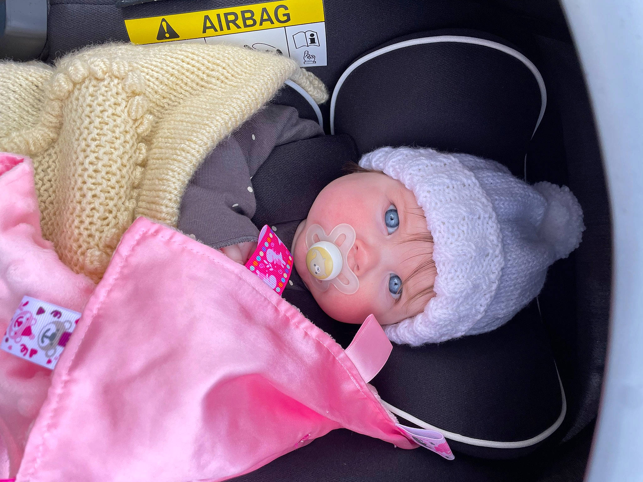 Freya joined the competition — help win amazing prizes! baby, baby_carriage, baby_in_car_seat, baby_products, baby_safety, baby_sleeping, baby_toddler_clothing, baby_toys, car_seat, cheek, child, comfort, headgear, headwear, infant_bed, linens, person, pink, room, sleep