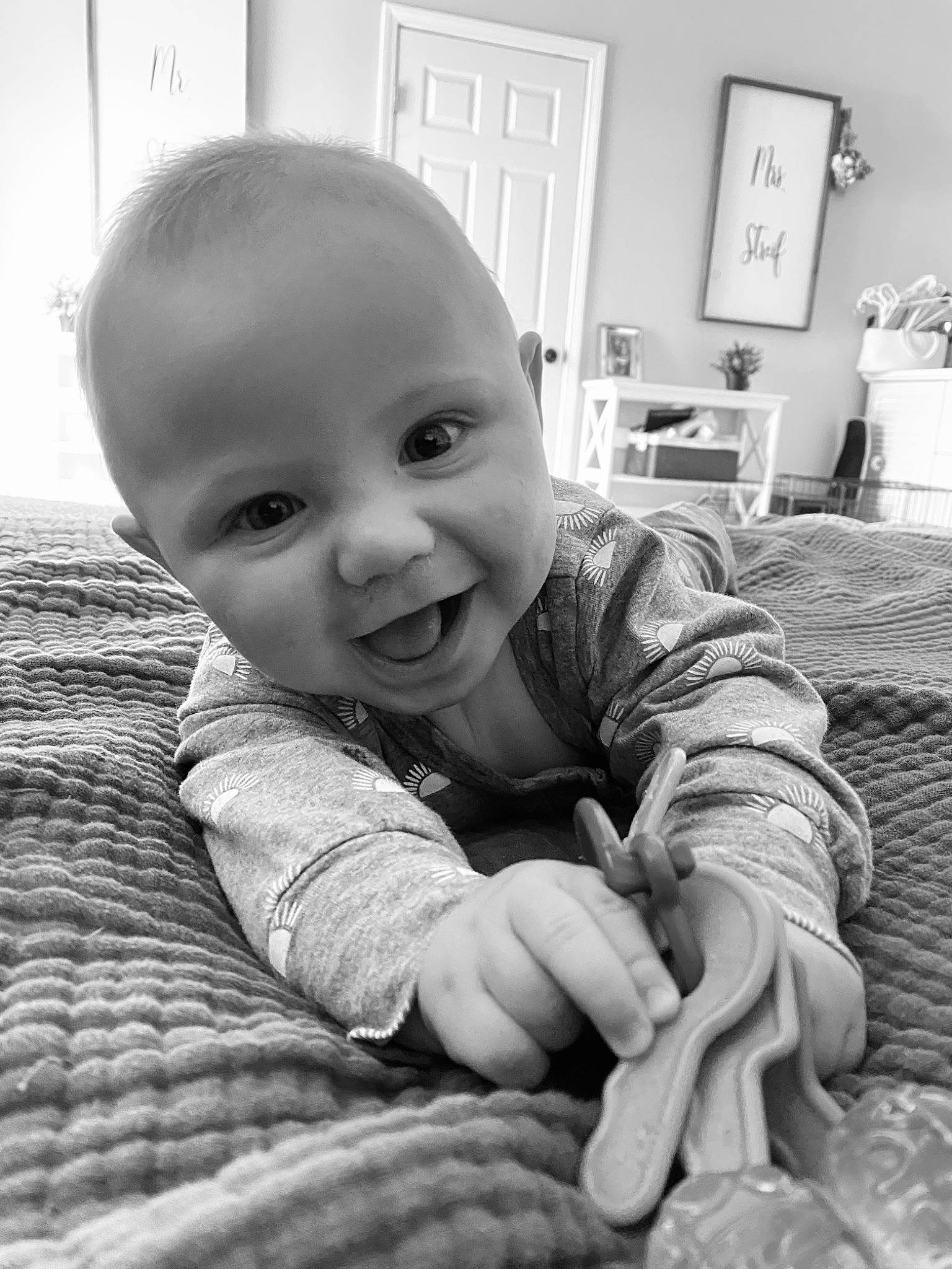 Hendrix is registered to the contest to win money with this photo: black, black_and_white, cheek, comfort, eye, finger, gesture, hairstyle, hand, happy, human_body, iris, nose, organ, person, photograph, skin, smile, standing, style