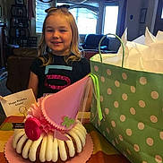 Ariana Joe joined the competition — help win amazing prizes! birthday, blonde_hair, cake, celebration, child, curtains, furniture, gift_bag, happy, home, icing, indoor, party, party_hat, person, polka_dots, present, smiling, table, young_girl
