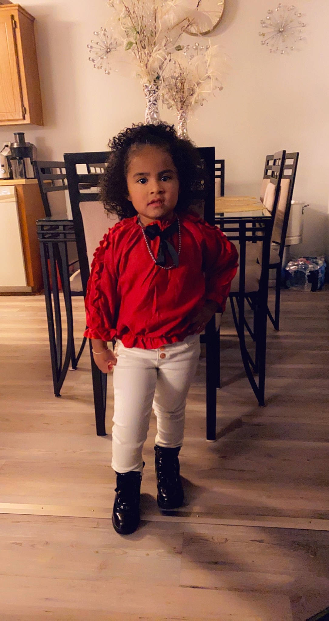 Ailany is registered to the contest to win money with this photo: boot, chair, child, event, fashion_design, flooring, formal_wear, fur, happy, hardwood, human_leg, knee, person, room, sitting, sleeve, standing, toddler, uniform, waist