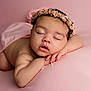adorable, baby, blanket, calm, child, closeup, cute, face, flower_headband, hands, head, infant, newborn, peaceful, pink, portrait, resting, skin, sleeping, soft
