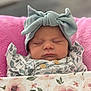 Paisley is registered to the contest to win money with this photo: baby, sleeping, headband, bow, blanket, floral_pattern, pink, cushion, soft, peaceful, face, clothing, newborn, portrait, infant, closeup, cute, resting, indoor, babywear