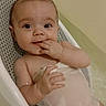 Dakota is registered to the contest to win money with this photo: baby, bath, bath_seat, bathtub, child, cute, eyes, fingers, gaze, hand, indoor, infant, mouth, plastic, portrait, relaxing, smile, towel, water, wet_skin