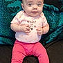 baby, infant, child, onesie, pink_leggings, smiling, sitting, blanket, couch, teal_blanket, face, big_eyes, hands, feet, toes, clothing, portrait, adorable, parenting, indoor