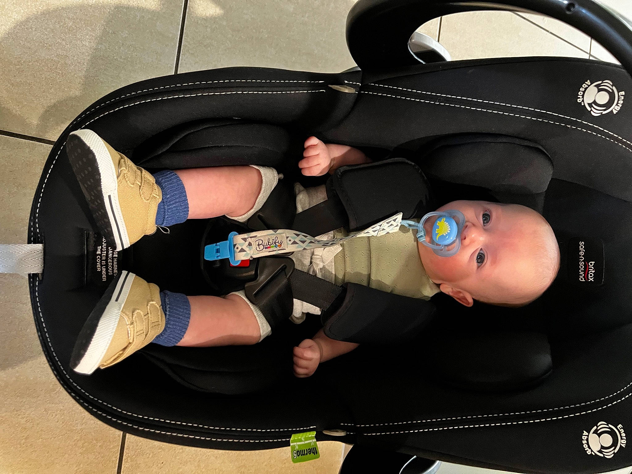 Bear is registered to the contest to win money with this photo: audio_equipment, auto_part, automotive_design, automotive_exterior, automotive_wheel_system, baby, baby_carriage, baby_products, baby_toddler_clothing, bumper, car_seat, circle, family_car, hat, hood, luxury_vehicle, person, personal_protective_equipment, toddler, vehicle