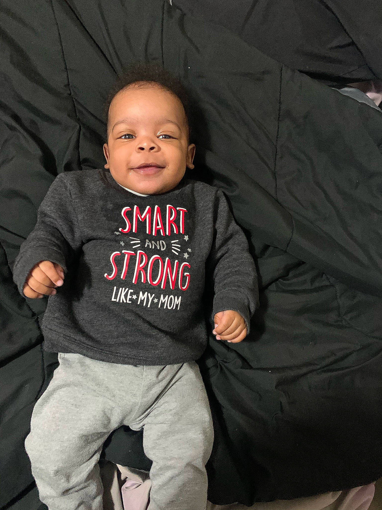 Braiden joined the competition — help win amazing prizes! baby, baby_toddler_clothing, comfort, cool, facial_expression, finger, flash_photography, fun, gesture, grey, hairstyle, happy, mouth, person, product, sleeve, smile, standing, style, t_shirt