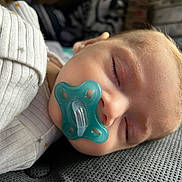 Kohen joined the competition — help win amazing prizes! baby, sleeping, pacifier, onesie, white_clothing, face, head, closeup, resting, infant, peaceful, child, soft_light, texture, fabric, cozy, indoors, portrait, cute, calm