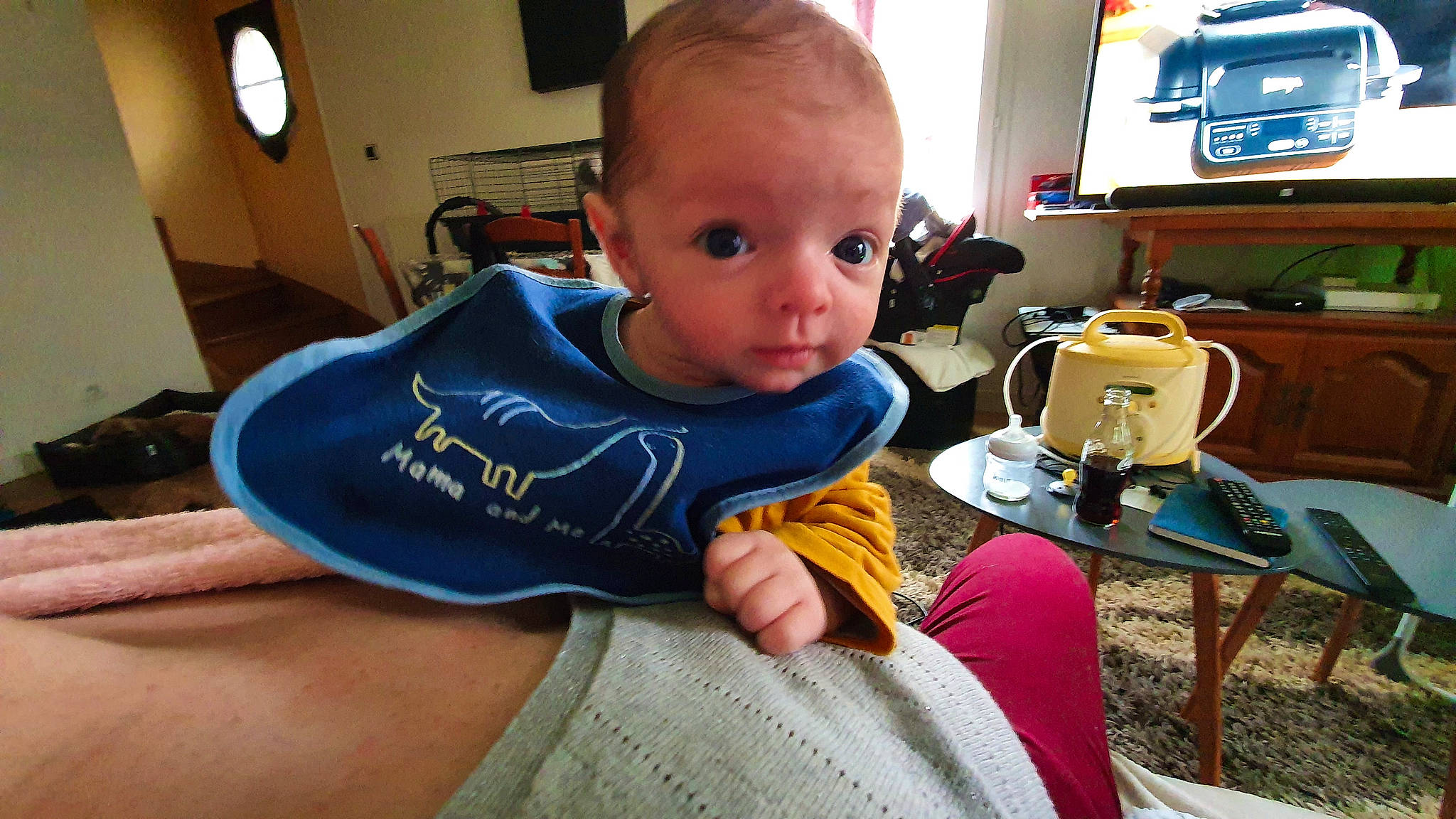 Hayden participe au concours pour gagner de l'argent avec cette photo : baby, baby_toddler_clothing, bag, chair, child, comfort, elbow, eyewear, flooring, fun, gadget, lap, luggage_and_bags, person, play, room, sitting, sleeve, t_shirt, toddler