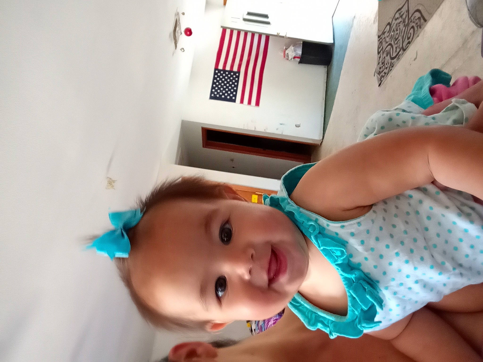 Sora is registered to the contest to win money with this photo: abdomen, baby, baby_products, baby_toddler_clothing, chest, child, elbow, finger, fun, hand, happy, hat, home_appliance, joy, machine, person, pink, room, skin, smile