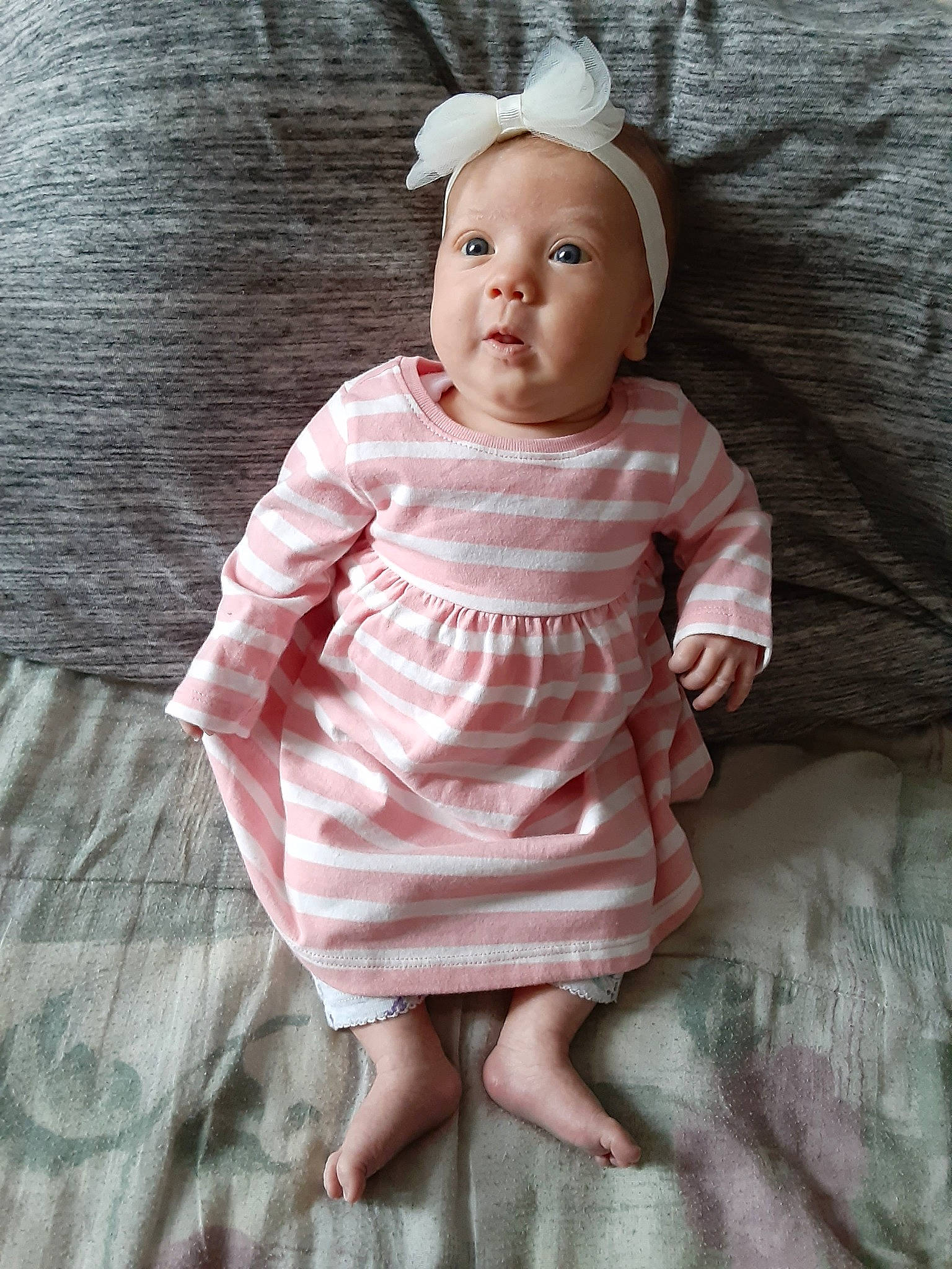 Luna joined the competition — help win amazing prizes! baby, baby_toddler_clothing, brown_hair, cheek, child, doll, dress, eye, face, head, person, pink, product, skin, sleeve, smile, toddler, toy