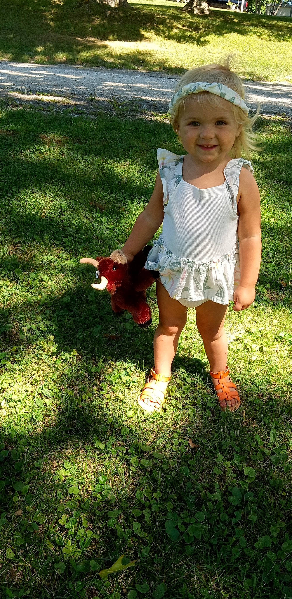 Charlie joined the competition — help win amazing prizes! baby_toddler_clothing, child, dress, eye, facial_expression, fun, grass, hand, happy, head, headwear, human_leg, joy, lawn, leg, leisure, pattern, people_in_nature, person, plant