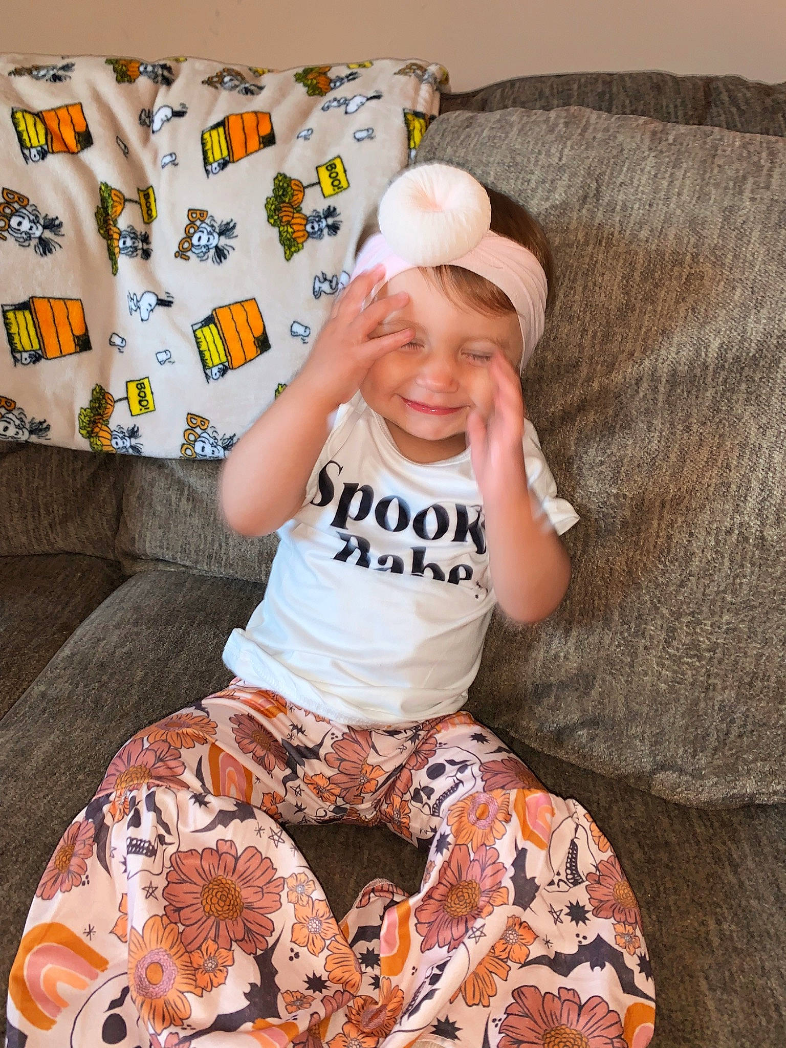 Kamille joined the competition — help win amazing prizes! arm, baby_toddler_clothing, baseball_cap, cap, child, comfort, costume_hat, couch, fun, happy, head, headwear, joy, linens, pattern, person, shorts, sitting, sleeve, smile