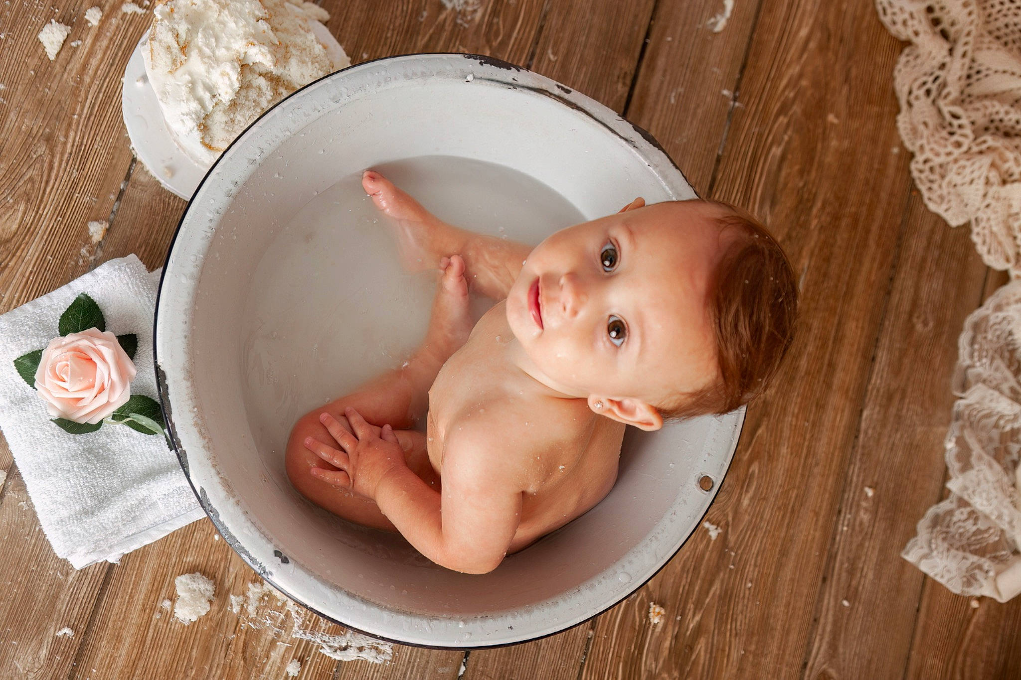 Kamille is registered to the contest to win money with this photo: abdomen, aluminium_foil, baby, baby_products, baby_toddler_clothing, bathing, cheek, chest, child, flesh, foil, foot, hardwood, human_body, person, serveware, sitting, stomach, tableware, toddler