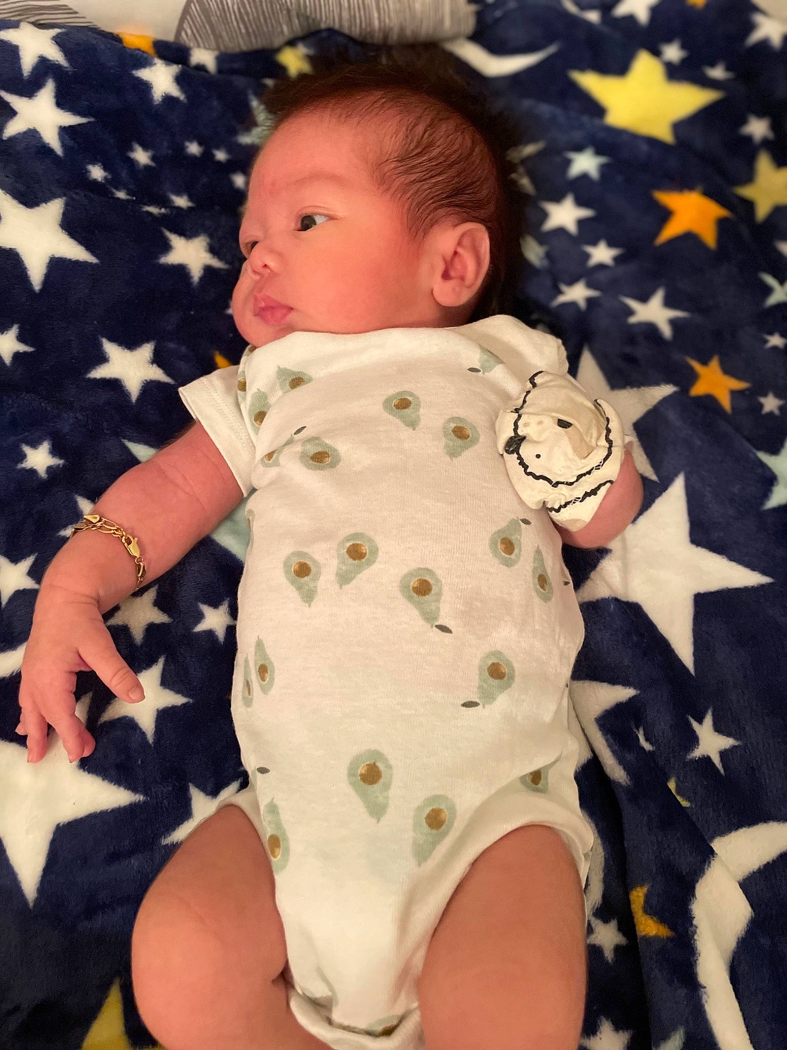 Alan is registered to the contest to win money with this photo: arm, baby, baby_toddler_clothing, cheek, child, comfort, eye, face, finger, head, human_body, infant_bodysuit, pattern, person, skin, sleeve, textile, thigh, thumb, toddler