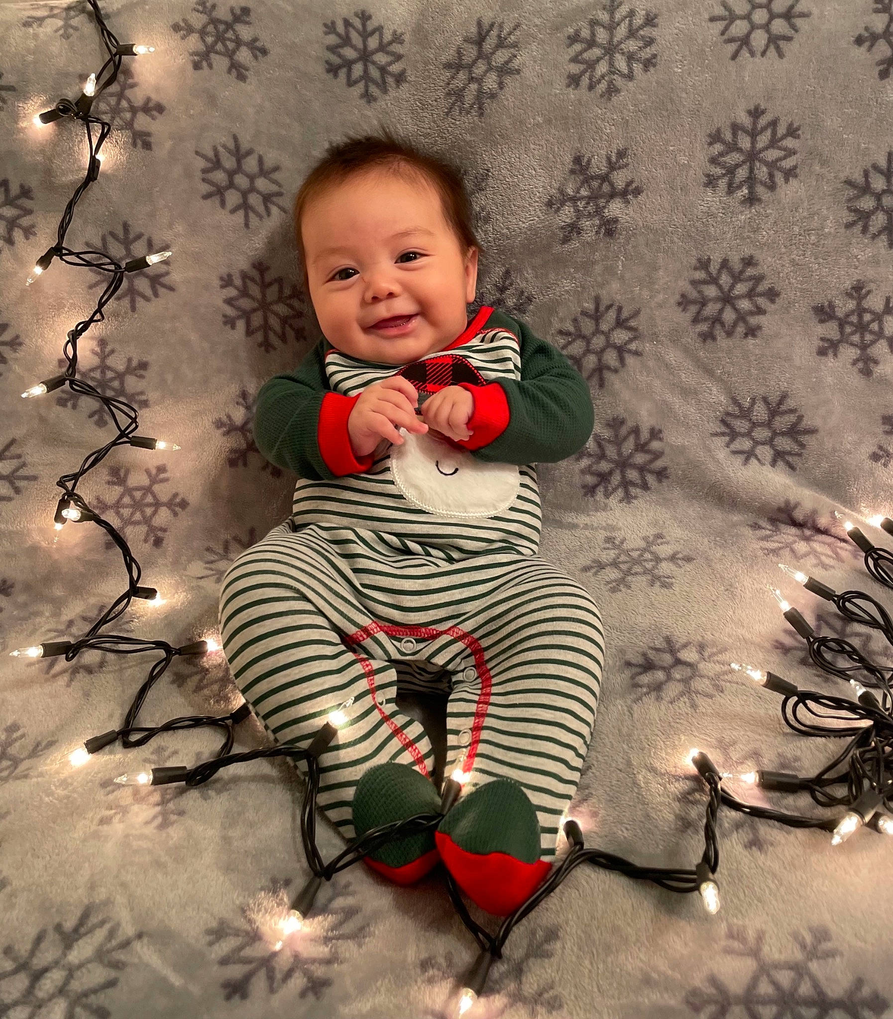Alan is registered to the contest to win money with this photo: art, baby, baby_toddler_clothing, christmas, christmas_ornament, eye, face, flash_photography, flooring, happy, head, human_body, joy, pattern, people_in_nature, person, plant, smile, t_shirt, toddler