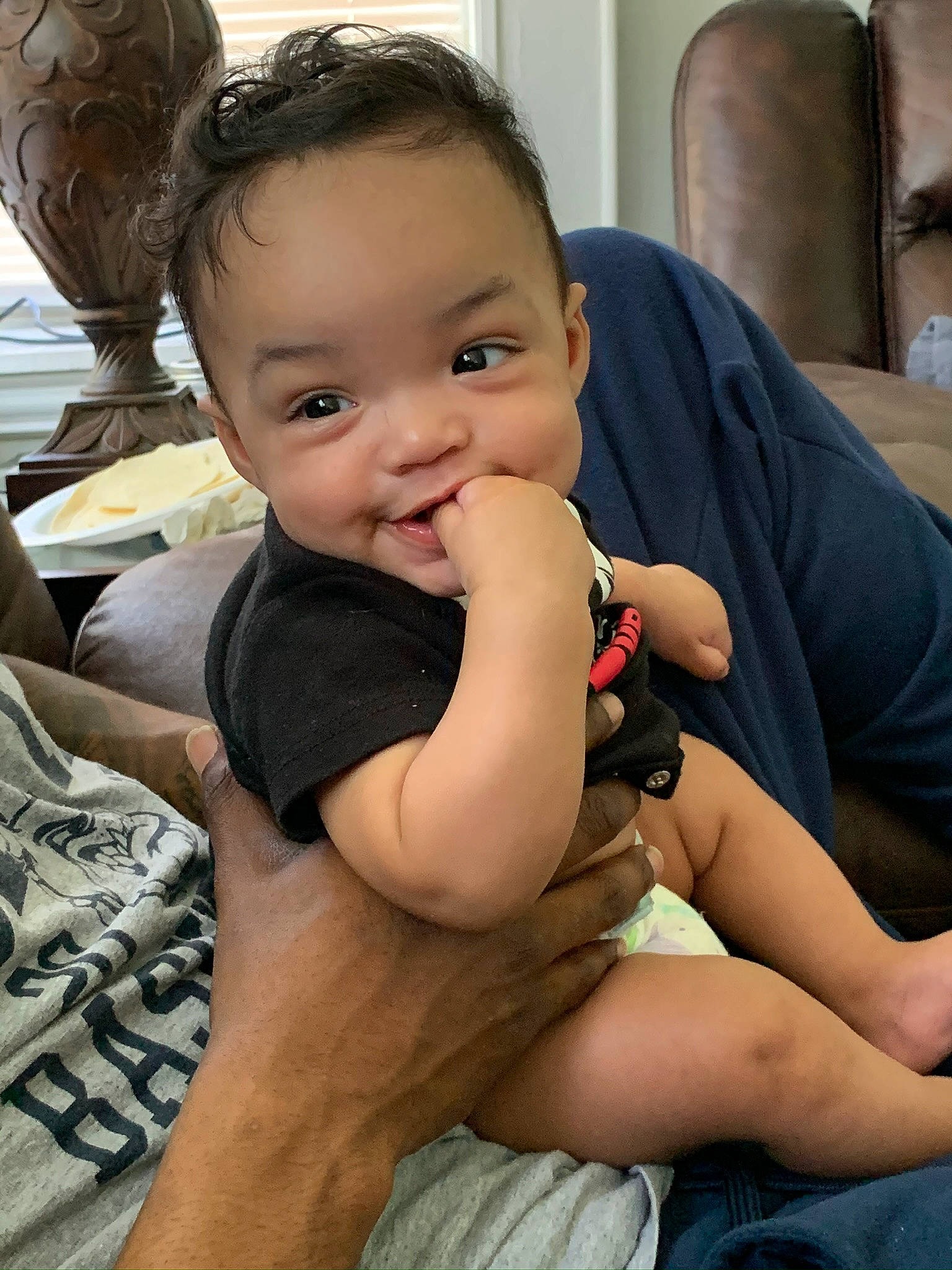 Maziyah is registered to the contest to win money with this photo: arm, baby, cheek, child, chin, face, finger, head, leg, person, sitting, skin, smile, thigh, thumb, toddler