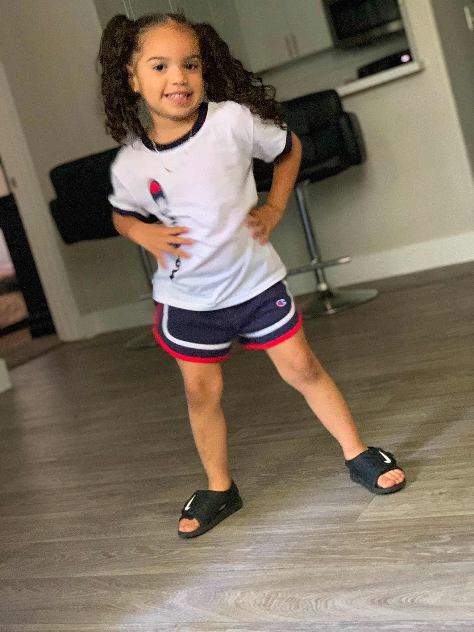 Zariyah is registered to the contest to win money with this photo: abdomen, arm, calf, child, competition_event, dance, exercise, footwear, hip, human_body, human_leg, joint, joy, knee, leg, person, shoe, shorts, shoulder, standing