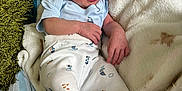Oliver joined the competition — help win amazing prizes! baby, bed, blanket, clothing, comfort, cozy, cute, expression, face, hand, hat, indoors, infant, lying_down, newborn, pajamas, person, sleepwear, small, soft