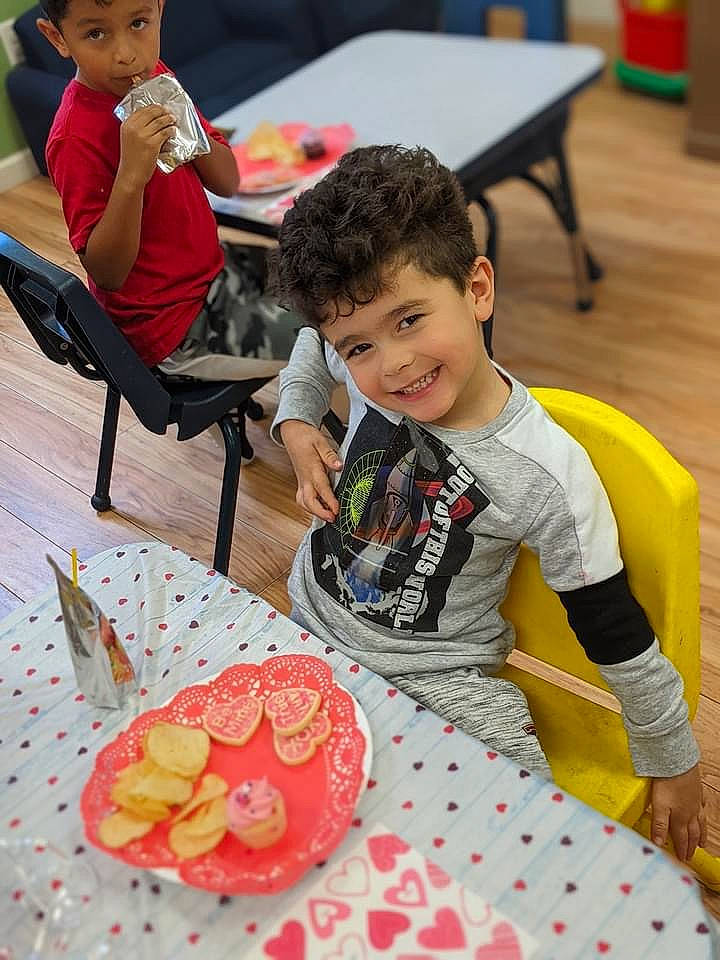 Jaxson joined the competition — help win amazing prizes! chair, child, citrullus, food, fruit, fun, green, head, headwear, ingredient, joy, leisure, melon, orange, person, plate, red, sharing, smile, table