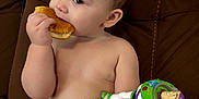 Jameson joined the competition — help win amazing prizes! baby, bodypart, bread, couch, cream, cutlery, dessert, diaper, eating, face, finger, food, furniture, hand, head, icing, person, photography, portrait, sweets