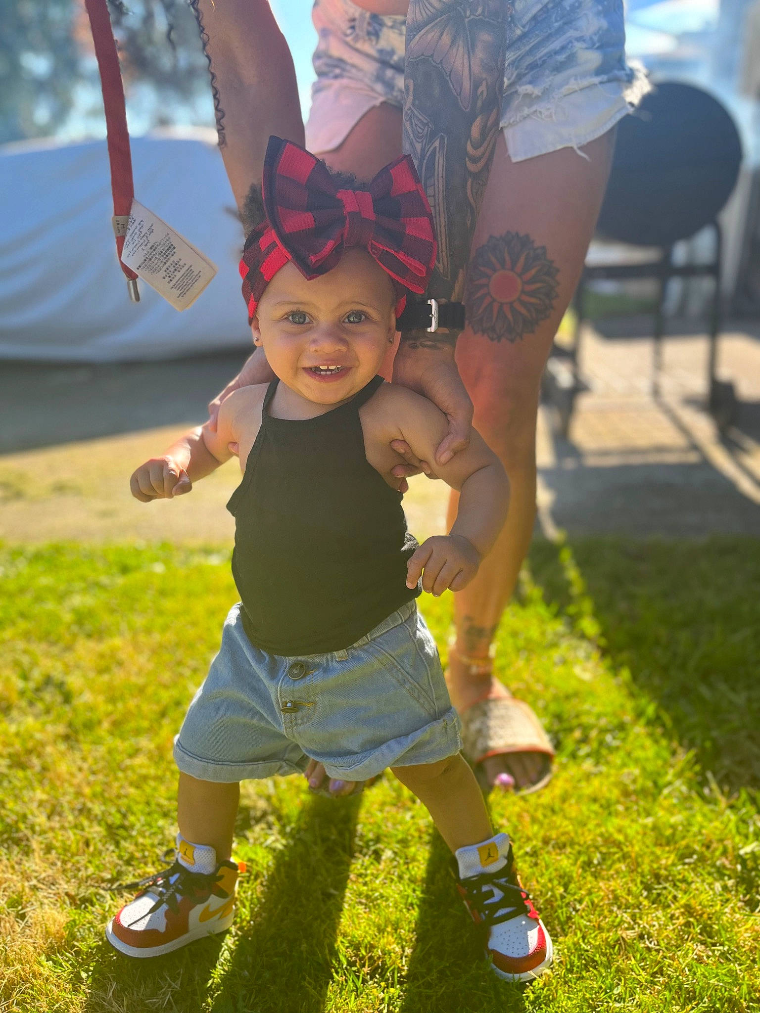 Valencia joined the competition — help win amazing prizes! chair, child, event, fun, grass, grassland, happy, hat, headwear, human_leg, joy, lawn, leisure, people_in_nature, person, recreation, sandal, shoe, shorts, smile