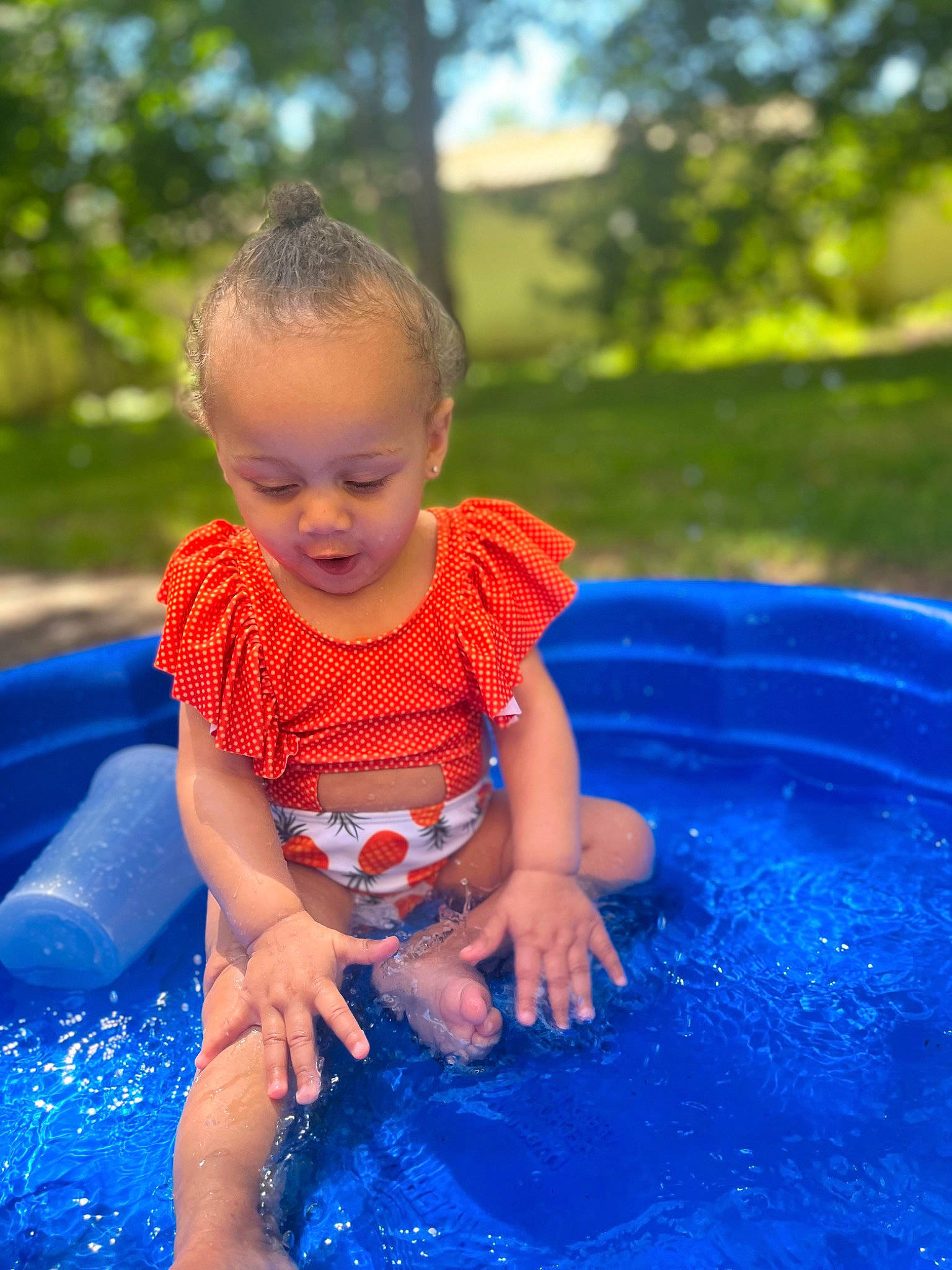 Valencia joined the competition — help win amazing prizes! baby, baby_toddler_clothing, bathing, blue, child, electric_blue, facial_expression, fun, grass, happy, leisure, people_in_nature, person, photograph, recreation, red, summer, toddler, tree, water