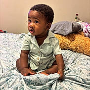 Liam joined the competition — help win amazing prizes! baby, bed, blanket, child, clothing, curly_hair, cute, expression, flower, hands, indoors, pattern, pillow, portrait, room, rose, sitting, skin, teddy_bear, young_child