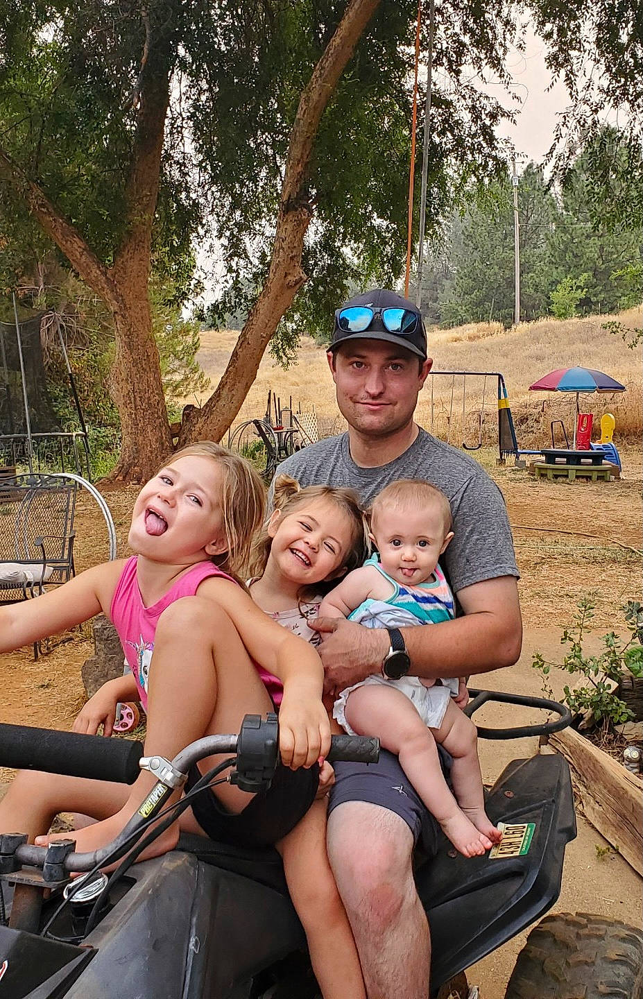 Baylee joined the competition — help win amazing prizes! event, fun, grass, happy, hat, headwear, joy, lap, leisure, mammal, motor_vehicle, person, plant, recreation, shorts, skin, smile, summer, sunglasses, swimwear