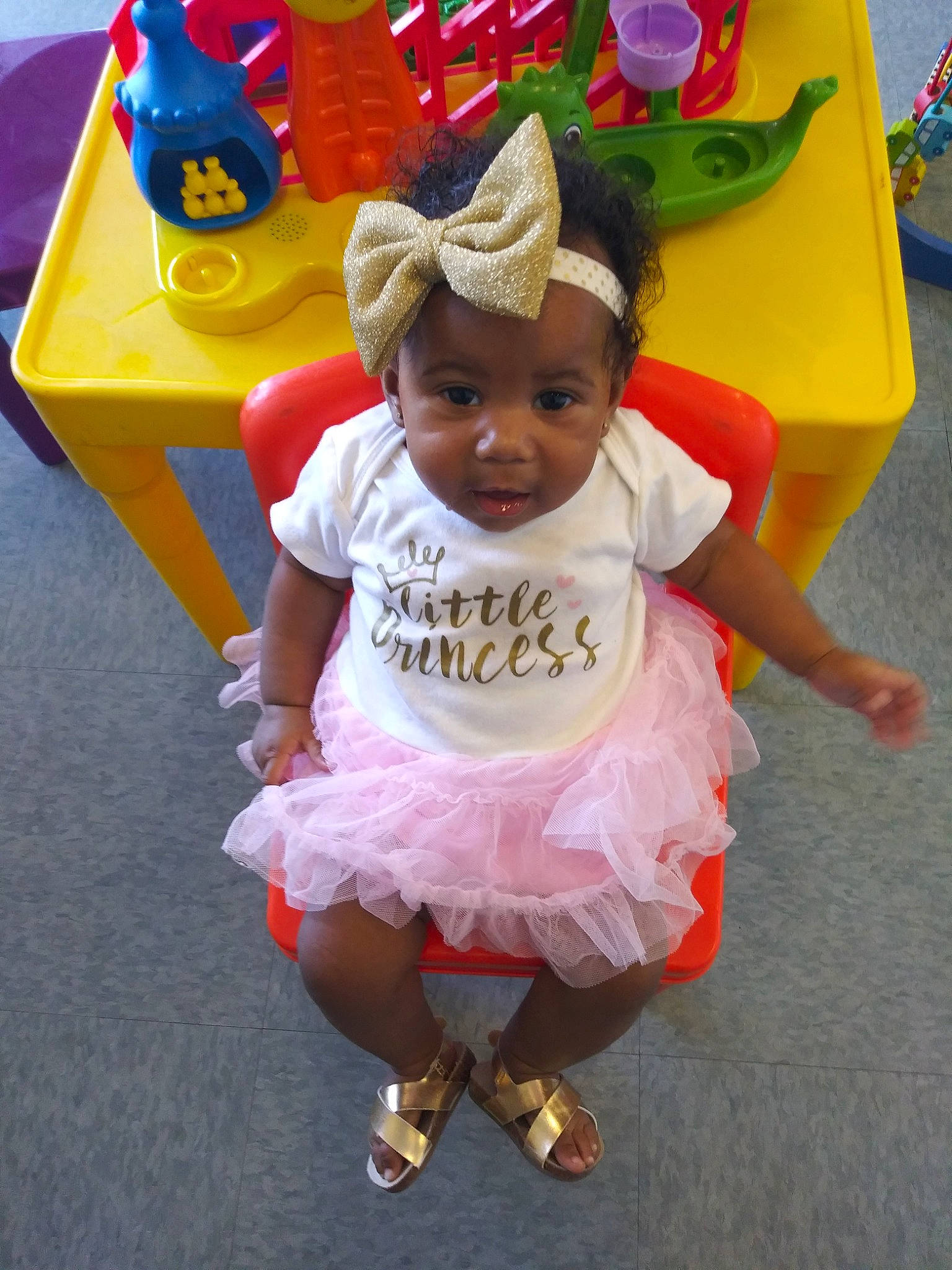 K'Miya joined the competition — help win amazing prizes! baby, child, costume, fun, party, person, pink, play, smile, toddler, yellow