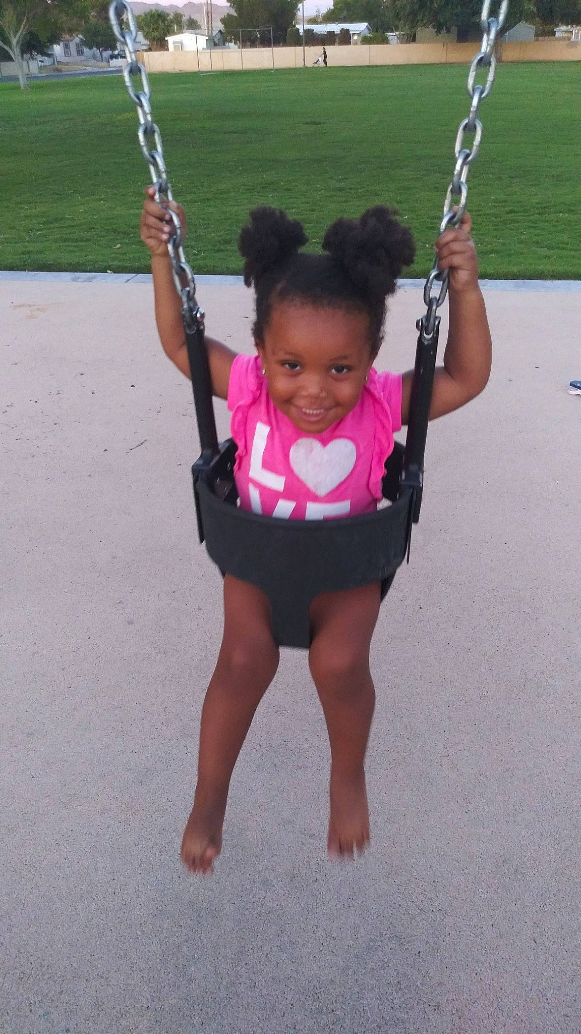 Kaya is registered to the contest to win money with this photo: child, joy, outdoor_play_equipment, person, swing, toddler