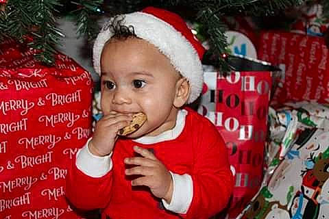Jakobe joined the competition — help win amazing prizes! baby, biting, child, christmas, christmas_decoration, christmas_eve, christmas_ornament, event, fictional_character, food_craving, fun, happy, holiday, holiday_ornament, person, red, sharing, sweetness, toddler, white