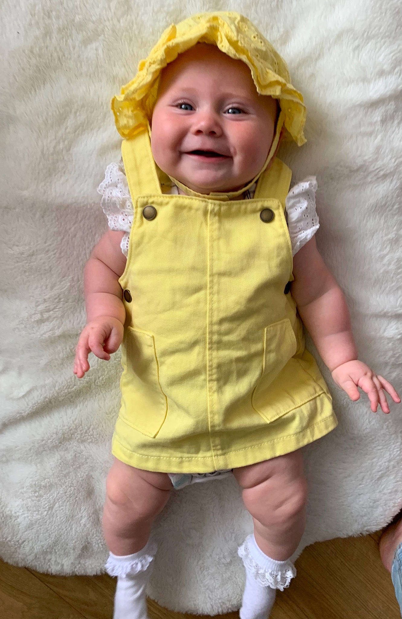 Harper joined the competition — help win amazing prizes! arm, baby, baby_toddler_clothing, cheek, eye, face, gesture, happy, head, headwear, human_body, joy, nose, outerwear, person, pink, skin, sleeve, smile, thumb